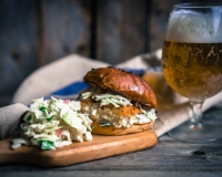 Rustic fish burgers with coleslaw and beer