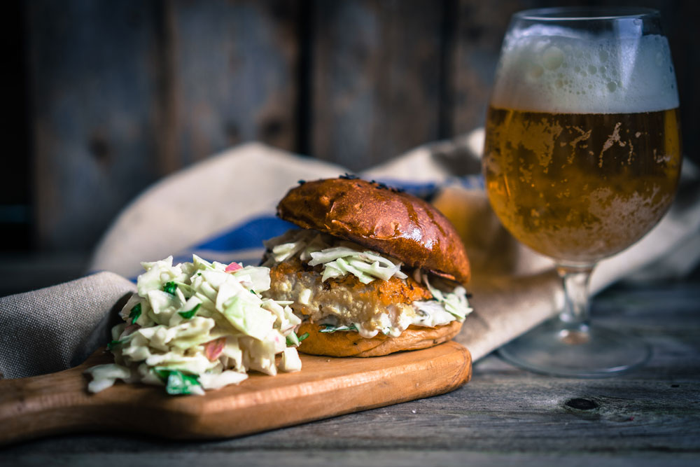 Rustic fish burgers with coleslaw and beer